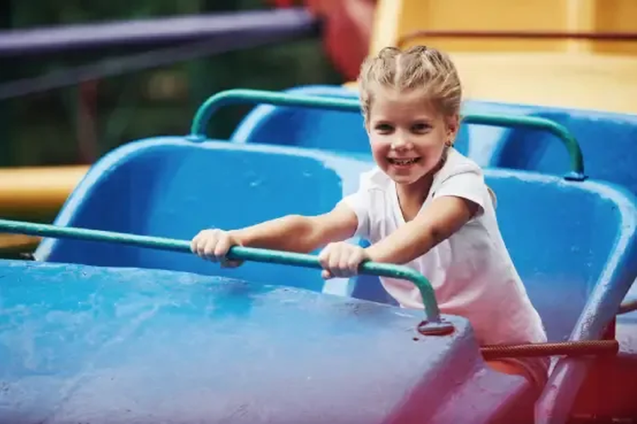 Happy female kid have fun on a roller coaster in t 2021 08 30 08 04 56 utc 1